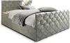 A bed with a headboard and footboard, made of upholstered material with a diamond pattern and crystal accents. It is made up of a mattress and topper, and has storage compartments. Produktbild-Vorschau