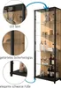 A tall glass display cabinet with wooden accents and LED lighting, showcasing various items on its shelves. Produktbild-Vorschau