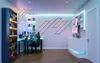 A modern gaming room with colorful LED lighting. Produktbild-Vorschau