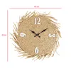 A round straw wall clock with white numbers and black hands, displayed against a white background. Dimensions are indicated by red lines and text. Podgląd zdjęcia produktu