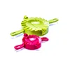 Two dumpling molds, one green and one pink, are shown against a white background. Anteprima dell’immagine prodotto