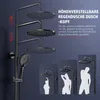 A black shower system with multiple showerheads and a handheld showerhead, displayed against a dark background with marketing text and silhouette illustrations of people of different heights using the shower. Anteprima dell’immagine prodotto
