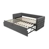 A gray upholstered daybed with its pull-out bed extended, showing the wooden slats. Produktbild-Vorschau