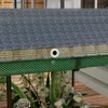 Close-up of a raised garden bed with a protective net and fabric cover. Produktbild-Vorschau