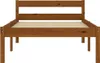 A wooden bed frame with a slatted base, shown from the front. Podgląd zdjęcia produktu