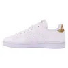 A side view of a white Adidas Advantage sneaker with gold accents. Podgląd zdjęcia produktu