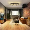 A modern living room with a leather sofa, coffee table, and a TV stand. Anteprima dell’immagine prodotto
