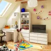 A child's room with a dresser, desk, and toys. Produktbild-Vorschau