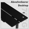 A close-up view of a black desk with text overlays indicating features. Produktbild-Vorschau