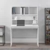 A white desk with a hutch is shown against a light gray wall. The desk has a laptop and some books on it. To the left is a small side table with books, and to the right is a metal shelving unit with various items. Produktbild-Vorschau