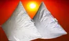 Two white pyramid-shaped pillows are shown against a sunset background. Produktbild-Vorschau