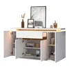 A white sideboard with a drawer and four doors, decorated with a vase of dried flowers, a framed picture, books, and bottles. Anteprima dell’immagine prodotto