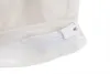 A close-up view of a white zipper on a white fabric. Produktbild-Vorschau