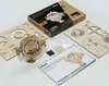 A wooden 3D puzzle of a perpetual calendar, along with its unassembled parts, assembly instructions, and packaging, laid out on a white surface. Anteprima dell’immagine prodotto