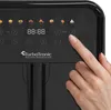 A close-up of a person's finger pressing a button on the digital control panel of a black air fryer. Produktbild-Vorschau