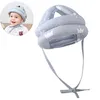 A baby wearing a protective helmet, with a close-up of the helmet itself. Produktbild-Vorschau