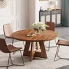 A round wooden dining table with chairs in a dining room setting. Podgląd zdjęcia produktu