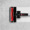 Close-up of a vacuum cleaner head on a carpeted surface. Produktbild-Vorschau