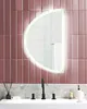 A modern bathroom sink area with a semi-circular LED mirror above it. Náhľad obrázku produktu