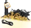 A battery-powered string of lights with a USB charging cable and a tag indicating features. Produktbild-Vorschau