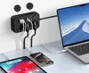 A black power strip with multiple outlets and USB ports is mounted on a wall, powering a laptop, tablet, and smartphone. Anteprima dell’immagine prodotto