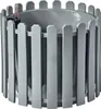 A gray planter with a decorative fence-like outer layer and a water level indicator. Produktbild-Vorschau