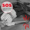 An elderly man has fallen on the stairs and is holding a personal alarm device. Produktbild-Vorschau
