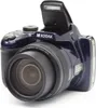 A blue Kodak digital camera with its flash popped up, shown from a 3/4 angle. Produktbild-Vorschau