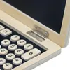 A close-up view of a wooden toy calculator with numbers and letters on the keys. Produktbild-Vorschau
