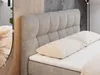 A close-up view of a beige upholstered bed with a tufted headboard and two pillows. Produktbild-Vorschau