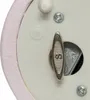 A close-up view of the bottom mechanism of a musical snow globe. Náhled obrázku produktu