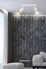 A modern living room with a brick accent wall and a ceiling light. Podgląd zdjęcia produktu