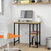 A computer desk with a monitor, chair, and books. Anteprima dell’immagine prodotto