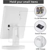 The back of a white makeup mirror with callouts for its features. Produktbild-Vorschau