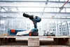 A Bosch impact wrench and battery are displayed on a wooden pallet in a construction setting. Produktbild-Vorschau