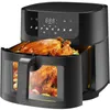 A black air fryer with a whole roasted chicken inside, viewed from the front. Produktbild-Vorschau