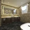 A luxurious bathroom with a large LED mirror, double vanity, and a bathtub. Produktbild-Vorschau