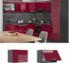 A modern kitchen with red high-gloss cabinets and a wooden table with chairs. Náhľad obrázku produktu