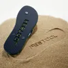 A flip-flop is placed on sand, with its imprint visible next to it. Produktbild-Vorschau