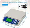 A digital kitchen scale shown with its dimensions and an included power adapter. Produktbild-Vorschau
