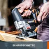 A person is using a cordless jigsaw to cut a piece of wood. Podgląd zdjęcia produktu