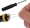 A hand is holding a tool to connect to a device, with a screwdriver in the background. Náhled obrázku produktu