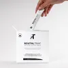 A hand is holding a single sachet of RevitalTrax anti-aging collagen complex above an open box of the product. Produktbild-Vorschau
