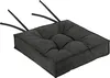 A dark gray tufted seat cushion with black ties, shown from a diagonal angle against a white background. Produktbild-Vorschau
