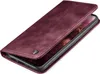 A close-up, angled view of a burgundy flip-style phone case with a phone inside. Produktbild-Vorschau