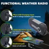 A functional weather radio is shown in a nighttime outdoor setting with a tent in the background. The image highlights the radio's charging input, power bank capability, and earphone jack. Produktbild-Vorschau