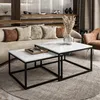 A modern living room scene with a couch, coffee tables, and decorative items. Produktbild-Vorschau