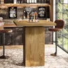 A bar area with a high table and stools, set up in a home or commercial space. Produktbild-Vorschau