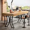 A bar table and stools on a balcony overlooking a city. Voir les images du produit