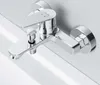 A chrome-finished bathtub faucet mounted on a white wall. Produktbild-Vorschau